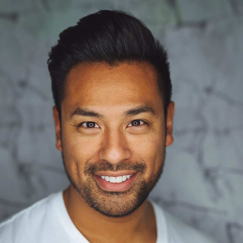 man wearing white V-neck shirt